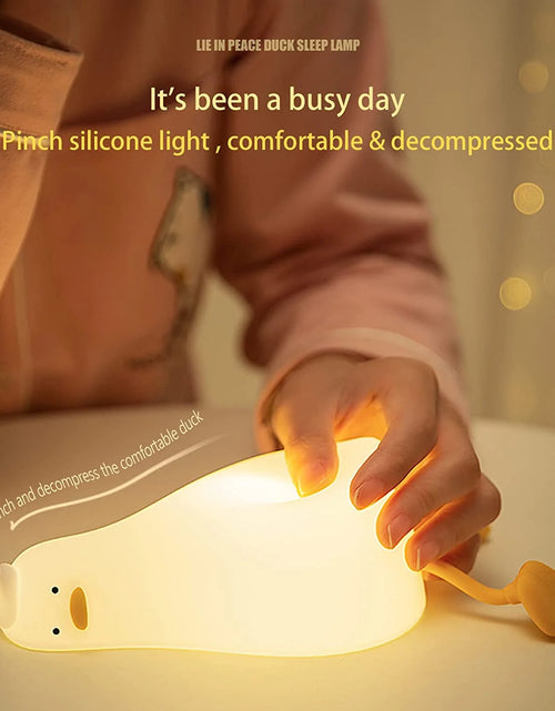 Load image into Gallery viewer, Lying Flat Duck Night Light, LED Squishy Duck Lamp, Cute Light up Duck, Silicone Dimmable Nursery Nightlight, Rechargeable Bedside Touch Lamp for Breastfeeding, Finn the Duck.
